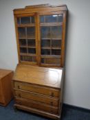 An Edwardian oak bureau bookcase