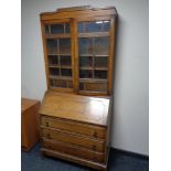 An Edwardian oak bureau bookcase