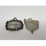 A silver Whisky decanter label and one other highly ornate silver label