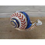 A Royal Crown Derby snail paperweight with stopper.