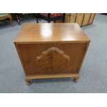 A twentieth century oak low cupboard