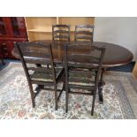 An oval oak refectory dining table fitted with internal leaf together with a set of four ladder