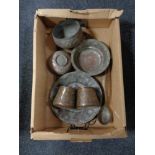 A box of antique Eastern copper ware, trays, planters,