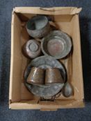 A box of antique Eastern copper ware, trays, planters,