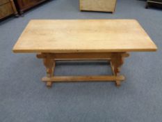 A blond oak refectory coffee table