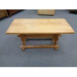 A blond oak refectory coffee table