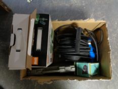 A box of 10V extension lead, two outdoor socket spikes,