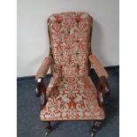 A Victorian scroll armchair upholstered in classical fabric