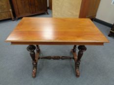 An antique mahogany library table with under stretcher