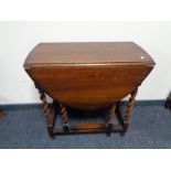 An Edwardian oak gateleg table