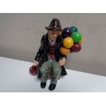 A Royal Doulton figure, The Old Balloon Seller, HN 1954.