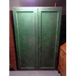 An antique pine painted double door cabinet