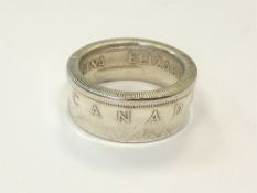 A Canadian dollar 1953 ring,