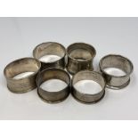 Six assorted silver napkin rings CONDITION REPORT: 92.