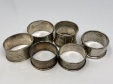 Six assorted silver napkin rings CONDITION REPORT: 92.