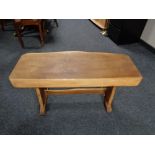 A rustic pine refectory coffee table
