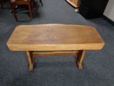 A rustic pine refectory coffee table