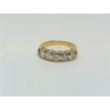 A fine 18ct gold five stone diamond half eternity ring, approximately 1.