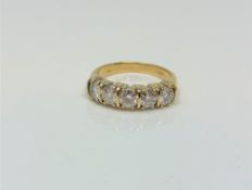 A fine 18ct gold five stone diamond half eternity ring, approximately 1.