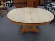 A continental oak pedestal oval extending dining table CONDITION REPORT: 153cm long