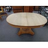 A continental oak pedestal oval extending dining table CONDITION REPORT: 153cm long