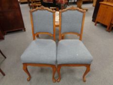 A pair of early twentieth century oak framed dining chairs