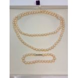 A cultured pearl necklace and similar bracelet with gold clasp