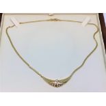 An 18ct gold diamond set necklace,