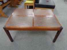 A mid century Danish rectangular coffee table with four tiled inserts