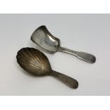 A Georgian silver caddy spoon and a Victorian example by George White (2)