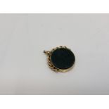 An antique gold swivel fob set with bloodstone
