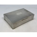 A good quality silver cigarette box with engine turned decoration,