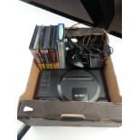 A box of Sega Mega Drive with controller and leads plus 3 games.