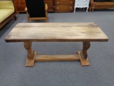 A twentieth century rustic oak refectory coffee table