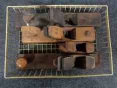 A basket of vintage wooden block planes