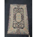 A Kashmiri hand stitched wool chain rug 120 cm x 73 cm