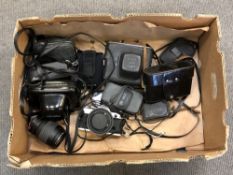 A quantity of cameras and lenses including Canon AE-1,