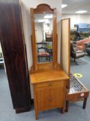 An early twentieth century stained pine washstand fitted with cupboard and drawer beneath