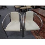 A set of four tubular metal plastic seated armchairs