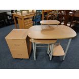 A contemporary pine effect computer desk together with two drawer filing chest