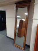 A large late nineteenth century continental walnut and ebonised hall mirror