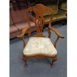 An antique oak carver armchair