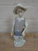 A Lladro figure of a fisherman,