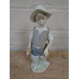 A Lladro figure of a fisherman,