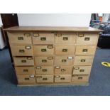 An Edwardian oak twenty drawer chest CONDITION REPORT: 136cm wide by 44cm deep by