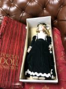 A boxed porcelain collection doll