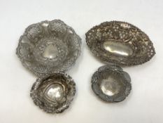 Four antique silver repousse dishes