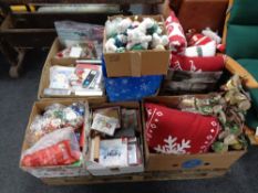 A pallet of Christmas decorations, soft toys, cushions, gift bags,