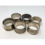 Six assorted silver napkin rings CONDITION REPORT: 90.