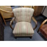 A twentieth century wooden framed armchair upholstered in striped fabric